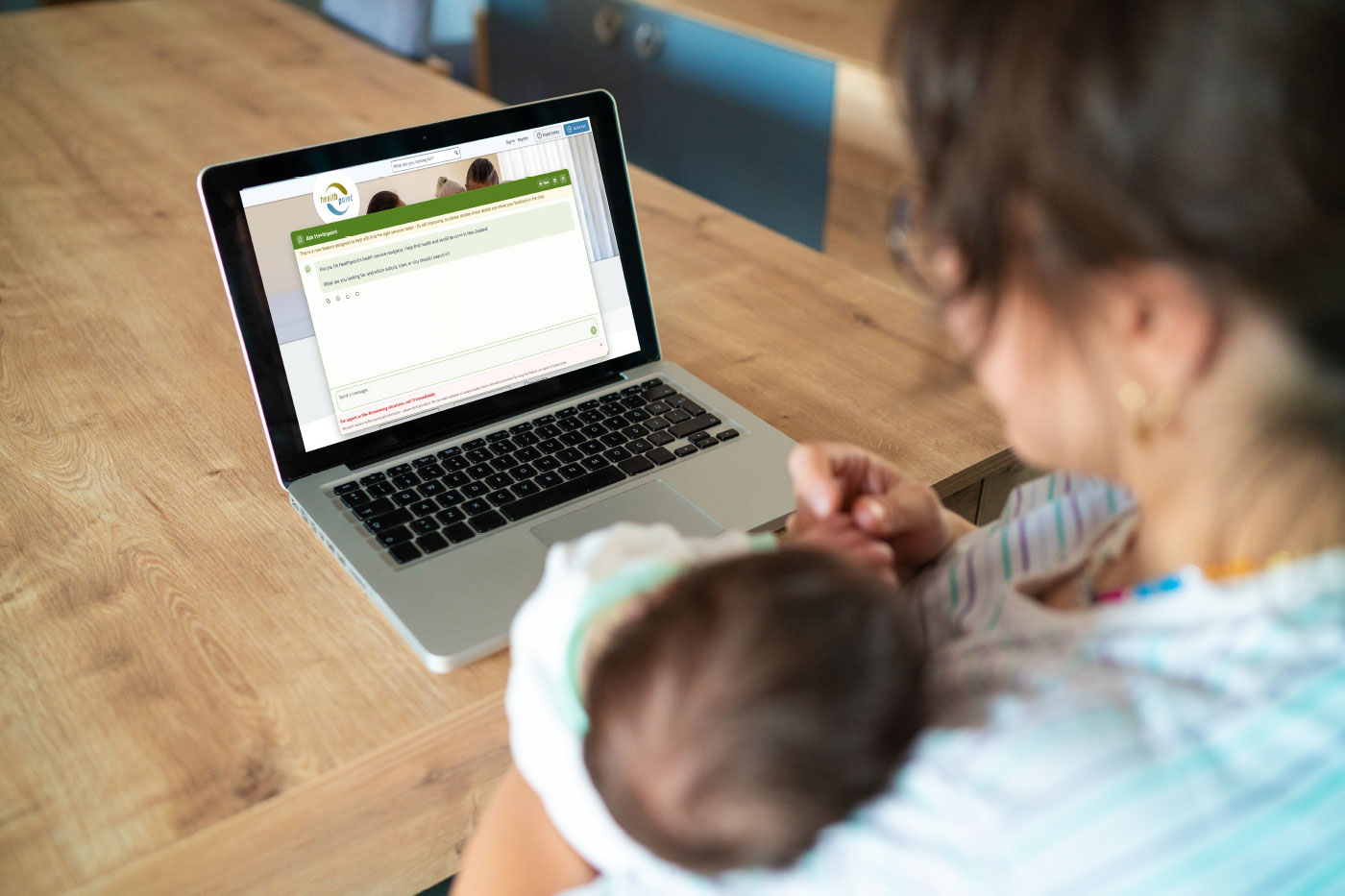 Mum with baby on computer